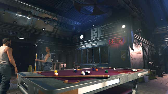 Two patrons play pool in Aggie's Bar. 