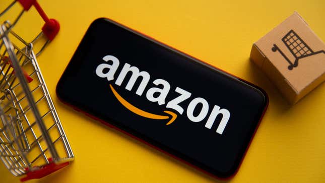 A phone shows the Amazon logo next to a small shopping cart and cardboard box.