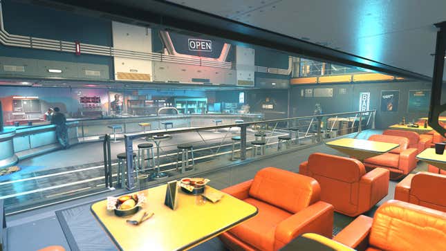 A shot of the unnamed bar on The Den shows its bright orange leather armchairs, bright lighting, and metal accents.